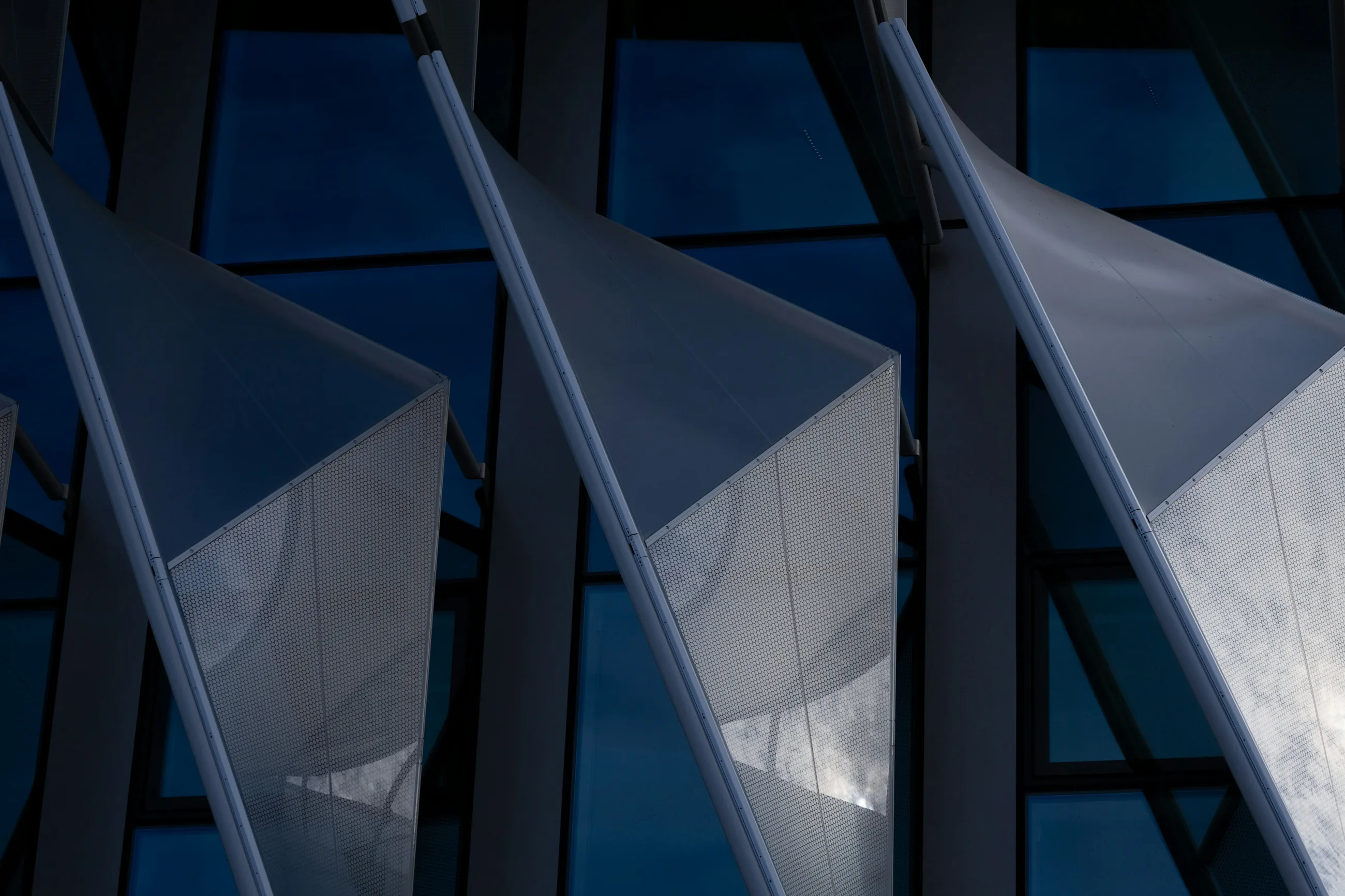 Abstract blue glass facade with geometric panels